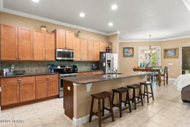 Welcome Home to your private oasis nestled along a peaceful on Plantation Bay Golf and Country Club in Florida - for sale on GolfHomes.com, golf home, golf lot