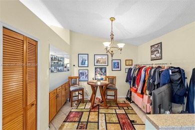 This beautiful 2-bedroom, 2-bathroom townhome features vaulted on Woodmont Country Club in Florida - for sale on GolfHomes.com, golf home, golf lot