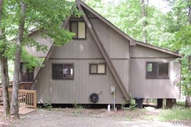 Private setting on lake Silveratta,  newer style custom chalet on Innsbrook Resort Golf Course in Missouri - for sale on GolfHomes.com, golf home, golf lot