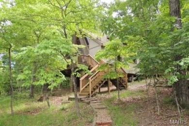Private setting on lake Silveratta,  newer style custom chalet on Innsbrook Resort Golf Course in Missouri - for sale on GolfHomes.com, golf home, golf lot