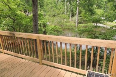 Private setting on lake Silveratta,  newer style custom chalet on Innsbrook Resort Golf Course in Missouri - for sale on GolfHomes.com, golf home, golf lot