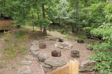 Private setting on lake Silveratta,  newer style custom chalet on Innsbrook Resort Golf Course in Missouri - for sale on GolfHomes.com, golf home, golf lot