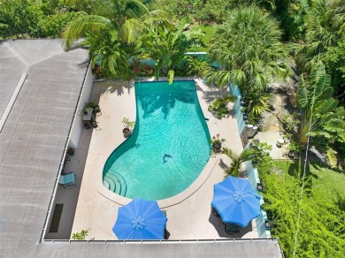 Elegant Mid-Century Modern Treasure with Timeless on Crane Creek Reserve Golf Club in Florida - for sale on GolfHomes.com, golf home, golf lot