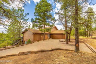Cabin style home with views of Mt. Elden. You feel like you are on Continental Country Club in Arizona - for sale on GolfHomes.com, golf home, golf lot
