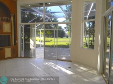 Allow yourself to be immersed in complete serenity and peace on Weston Hills Country Club in Florida - for sale on GolfHomes.com, golf home, golf lot