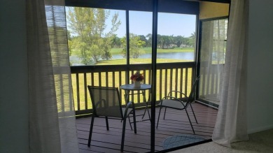 Newly painted, spacious 2/2 condo with water views from all on Village Golf Club in Florida - for sale on GolfHomes.com, golf home, golf lot