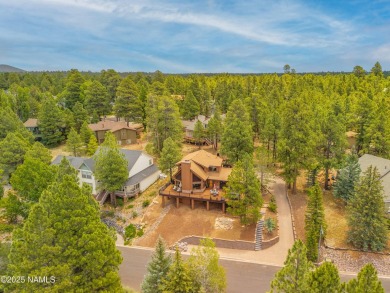 Cabin style home with views of Mt. Elden. You feel like you are on Continental Country Club in Arizona - for sale on GolfHomes.com, golf home, golf lot