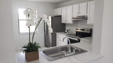 Newly painted, spacious 2/2 condo with water views from all on Village Golf Club in Florida - for sale on GolfHomes.com, golf home, golf lot