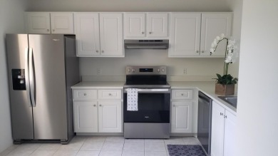 Newly painted, spacious 2/2 condo with water views from all on Village Golf Club in Florida - for sale on GolfHomes.com, golf home, golf lot