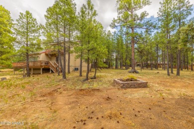 Cabin style home with views of Mt. Elden. You feel like you are on Continental Country Club in Arizona - for sale on GolfHomes.com, golf home, golf lot