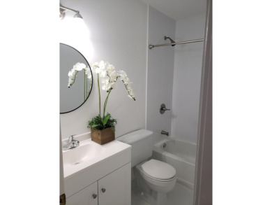 Newly painted, spacious 2/2 condo with water views from all on Village Golf Club in Florida - for sale on GolfHomes.com, golf home, golf lot