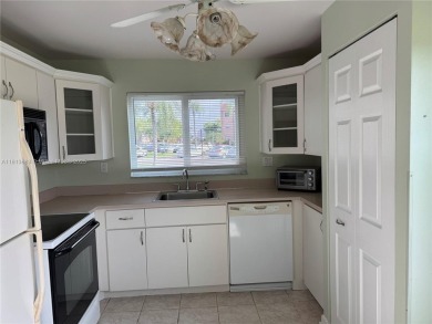 Discover the potential of this spacious 2 BR, 2 BTH corner condo on Sunrise Lakes Phase III in Florida - for sale on GolfHomes.com, golf home, golf lot