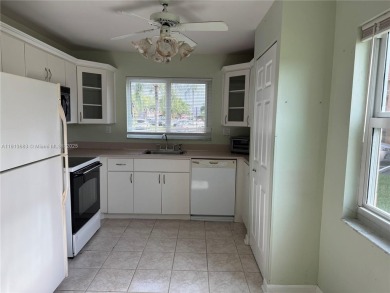 Discover the potential of this spacious 2 BR, 2 BTH corner condo on Sunrise Lakes Phase III in Florida - for sale on GolfHomes.com, golf home, golf lot