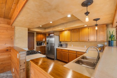 Cabin style home with views of Mt. Elden. You feel like you are on Continental Country Club in Arizona - for sale on GolfHomes.com, golf home, golf lot