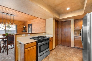 Cabin style home with views of Mt. Elden. You feel like you are on Continental Country Club in Arizona - for sale on GolfHomes.com, golf home, golf lot