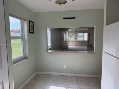 Discover the potential of this spacious 2 BR, 2 BTH corner condo on Sunrise Lakes Phase III in Florida - for sale on GolfHomes.com, golf home, golf lot