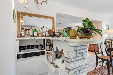 Elegant Mid-Century Modern Treasure with Timeless on Crane Creek Reserve Golf Club in Florida - for sale on GolfHomes.com, golf home, golf lot