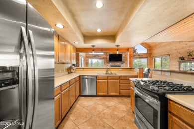 Cabin style home with views of Mt. Elden. You feel like you are on Continental Country Club in Arizona - for sale on GolfHomes.com, golf home, golf lot