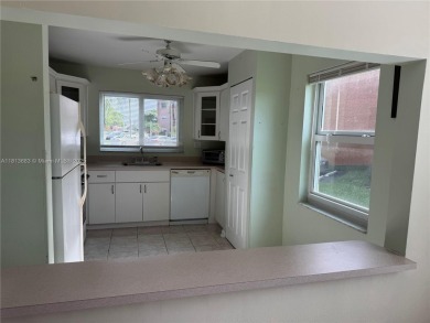Discover the potential of this spacious 2 BR, 2 BTH corner condo on Sunrise Lakes Phase III in Florida - for sale on GolfHomes.com, golf home, golf lot