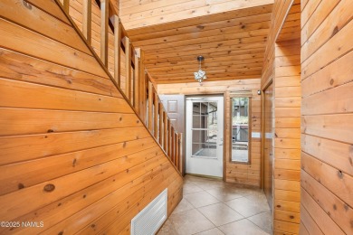 Cabin style home with views of Mt. Elden. You feel like you are on Continental Country Club in Arizona - for sale on GolfHomes.com, golf home, golf lot