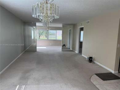 Discover the potential of this spacious 2 BR, 2 BTH corner condo on Sunrise Lakes Phase III in Florida - for sale on GolfHomes.com, golf home, golf lot
