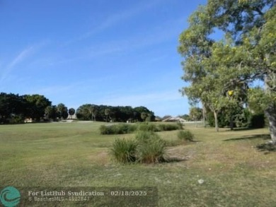 Allow yourself to be immersed in complete serenity and peace on Weston Hills Country Club in Florida - for sale on GolfHomes.com, golf home, golf lot