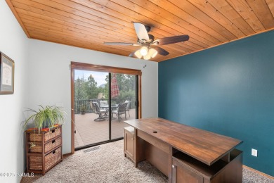 Cabin style home with views of Mt. Elden. You feel like you are on Continental Country Club in Arizona - for sale on GolfHomes.com, golf home, golf lot