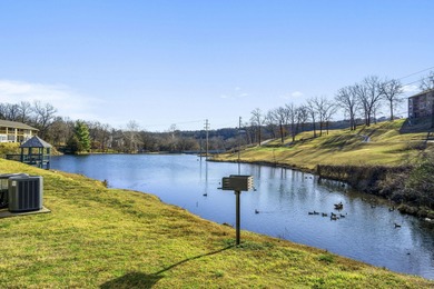 Wake up to the gentle shimmer of Lake Taneycomo right outside on Pointe Royale Village Country Club in Missouri - for sale on GolfHomes.com, golf home, golf lot