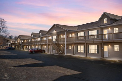 Wake up to the gentle shimmer of Lake Taneycomo right outside on Pointe Royale Village Country Club in Missouri - for sale on GolfHomes.com, golf home, golf lot