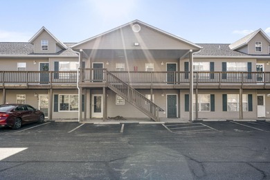 Wake up to the gentle shimmer of Lake Taneycomo right outside on Pointe Royale Village Country Club in Missouri - for sale on GolfHomes.com, golf home, golf lot