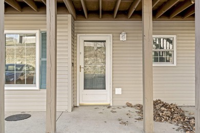 Wake up to the gentle shimmer of Lake Taneycomo right outside on Pointe Royale Village Country Club in Missouri - for sale on GolfHomes.com, golf home, golf lot