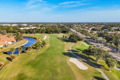 One or more photo(s) has been virtually staged. PRICE ADJUSTMENT on Pelican Pointe Golf and Country Club in Florida - for sale on GolfHomes.com, golf home, golf lot