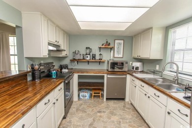 Step into the serene oasis of Myrtle Beach Golf & Yacht, a on Heron Point Golf Club in South Carolina - for sale on GolfHomes.com, golf home, golf lot