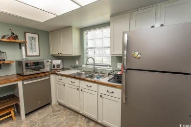 Step into the serene oasis of Myrtle Beach Golf & Yacht, a on Heron Point Golf Club in South Carolina - for sale on GolfHomes.com, golf home, golf lot
