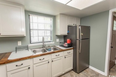 Step into the serene oasis of Myrtle Beach Golf & Yacht, a on Heron Point Golf Club in South Carolina - for sale on GolfHomes.com, golf home, golf lot