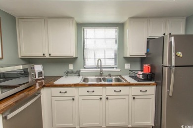 Step into the serene oasis of Myrtle Beach Golf & Yacht, a on Heron Point Golf Club in South Carolina - for sale on GolfHomes.com, golf home, golf lot