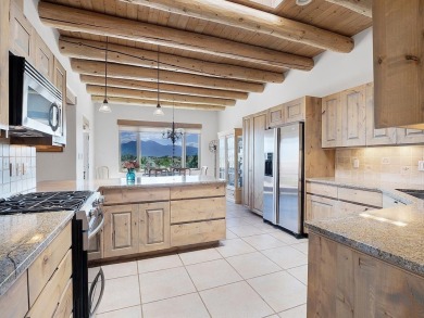 This exceptional adobe-style home, with a stucco exterior and on Taos Country Club in New Mexico - for sale on GolfHomes.com, golf home, golf lot