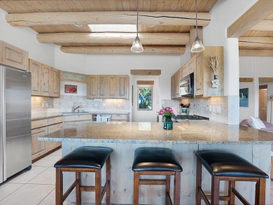 This exceptional adobe-style home, with a stucco exterior and on Taos Country Club in New Mexico - for sale on GolfHomes.com, golf home, golf lot