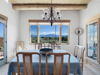 This exceptional adobe-style home, with a stucco exterior and on Taos Country Club in New Mexico - for sale on GolfHomes.com, golf home, golf lot