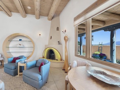 This exceptional adobe-style home, with a stucco exterior and on Taos Country Club in New Mexico - for sale on GolfHomes.com, golf home, golf lot