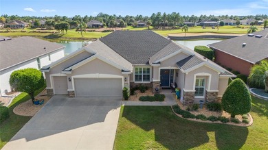 Fall in love with the STUNNING LAKE AND GOLF COURSE VIEWS that on Stone Creek Golf Club in Florida - for sale on GolfHomes.com, golf home, golf lot