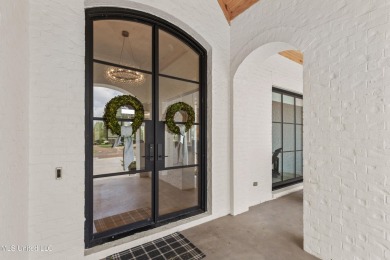 Experience resort-style living in this exceptional residence on Reunion Golf Club in Mississippi - for sale on GolfHomes.com, golf home, golf lot