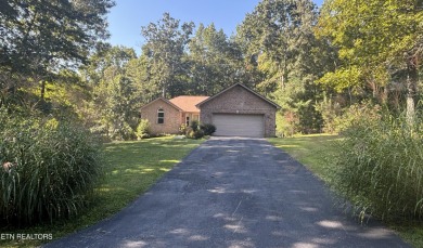 Brick Basement Ranch with two car garage on main level and on Lake Tansi Village Country Club in Tennessee - for sale on GolfHomes.com, golf home, golf lot