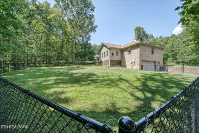 Brick Basement Ranch with two car garage on main level and on Lake Tansi Village Country Club in Tennessee - for sale on GolfHomes.com, golf home, golf lot