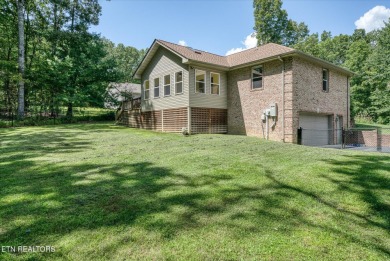 Brick Basement Ranch with two car garage on main level and on Lake Tansi Village Country Club in Tennessee - for sale on GolfHomes.com, golf home, golf lot