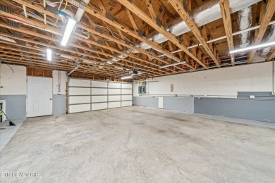 Brick Basement Ranch with two car garage on main level and on Lake Tansi Village Country Club in Tennessee - for sale on GolfHomes.com, golf home, golf lot