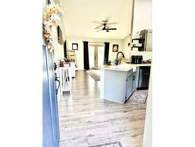 Check out this beautifully maintained home nestled in the on The Grand Club - Pine Lakes Course in Florida - for sale on GolfHomes.com, golf home, golf lot