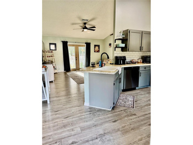 Check out this beautifully maintained home nestled in the on The Grand Club - Pine Lakes Course in Florida - for sale on GolfHomes.com, golf home, golf lot