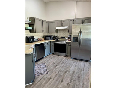 Check out this beautifully maintained home nestled in the on The Grand Club - Pine Lakes Course in Florida - for sale on GolfHomes.com, golf home, golf lot