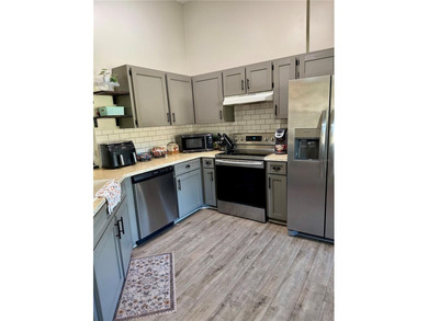 Check out this beautifully maintained home nestled in the on The Grand Club - Pine Lakes Course in Florida - for sale on GolfHomes.com, golf home, golf lot